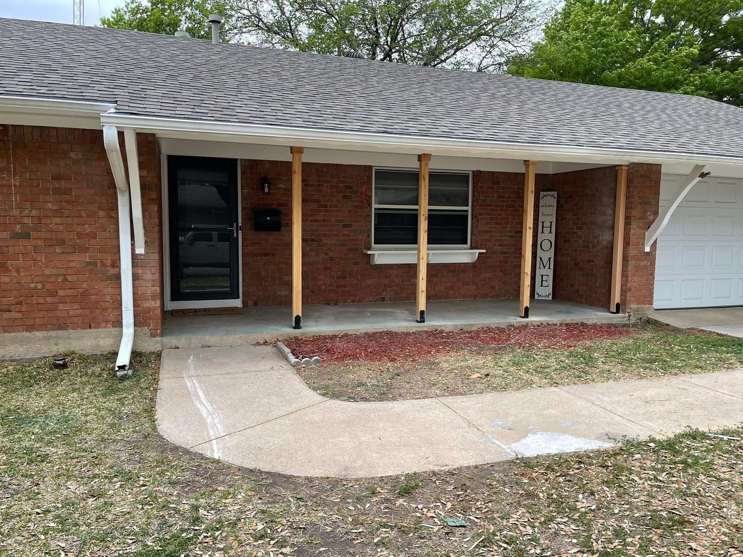 Exterior House Remodel with Open Porch & Cedar Posts